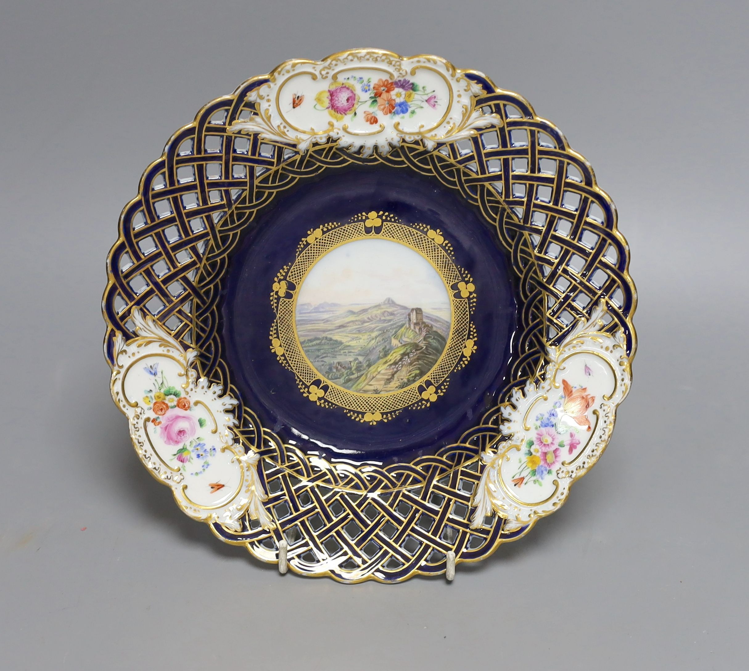 A 19th-century Meissen pierced dish painted with a titled view ‘Hohenstaufen und Rechberg’ - 23cm diameter